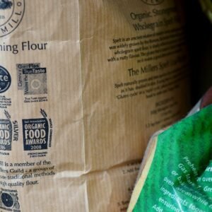 brown paper bag on green textile